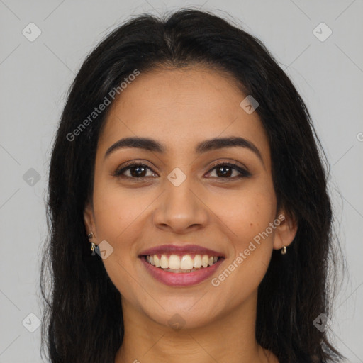 Joyful latino young-adult female with long  brown hair and brown eyes