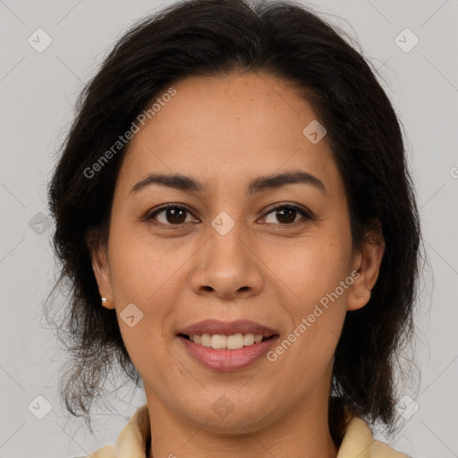 Joyful latino young-adult female with medium  brown hair and brown eyes