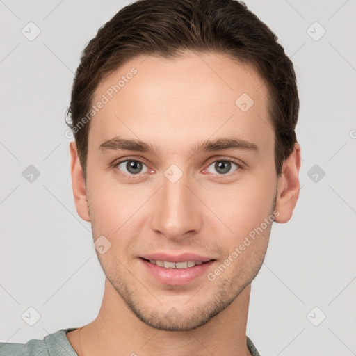 Joyful white young-adult male with short  brown hair and grey eyes