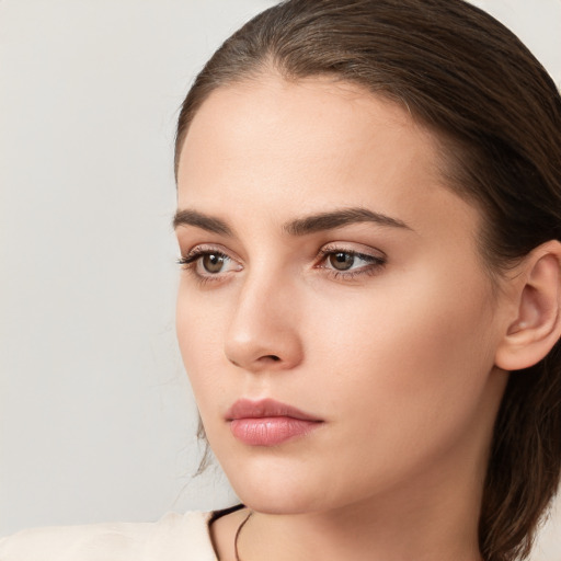 Neutral white young-adult female with medium  brown hair and brown eyes