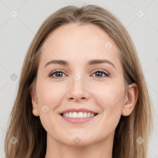 Joyful white young-adult female with long  brown hair and grey eyes