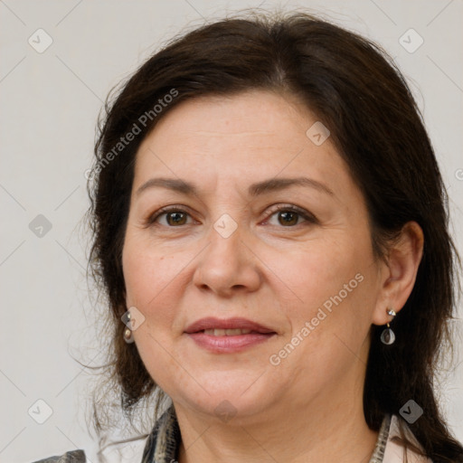 Joyful white adult female with medium  brown hair and brown eyes