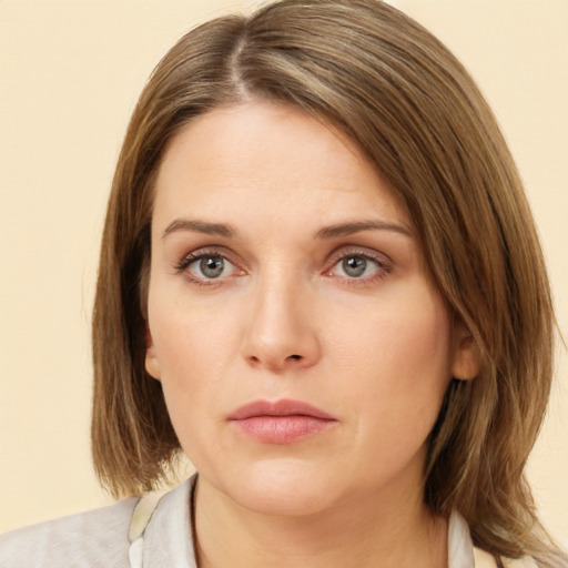 Neutral white young-adult female with medium  brown hair and grey eyes