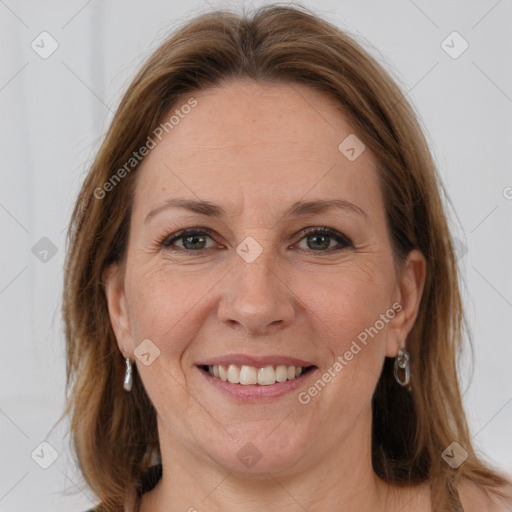 Joyful white adult female with medium  brown hair and grey eyes