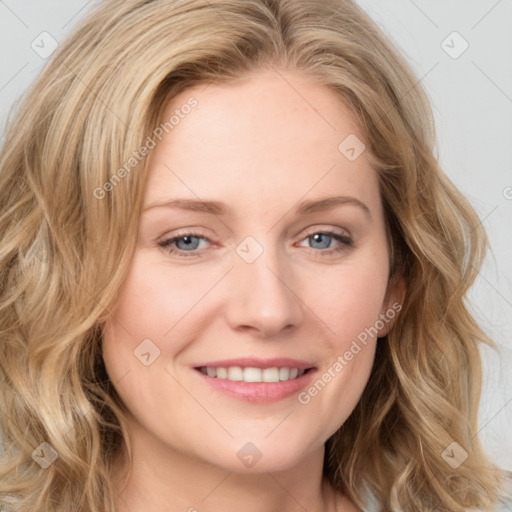 Joyful white young-adult female with long  brown hair and blue eyes