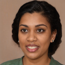 Joyful black young-adult female with medium  brown hair and brown eyes