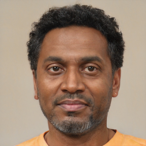 Neutral latino adult male with short  black hair and brown eyes