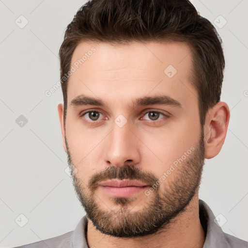 Neutral white young-adult male with short  brown hair and brown eyes