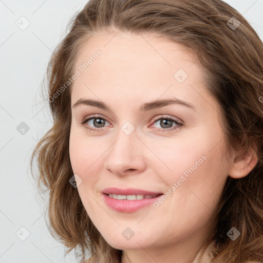 Joyful white young-adult female with medium  brown hair and green eyes