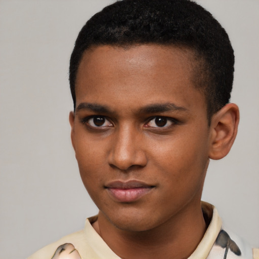 Joyful latino young-adult male with short  brown hair and brown eyes