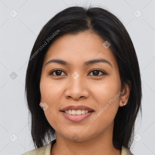 Joyful asian young-adult female with long  brown hair and brown eyes