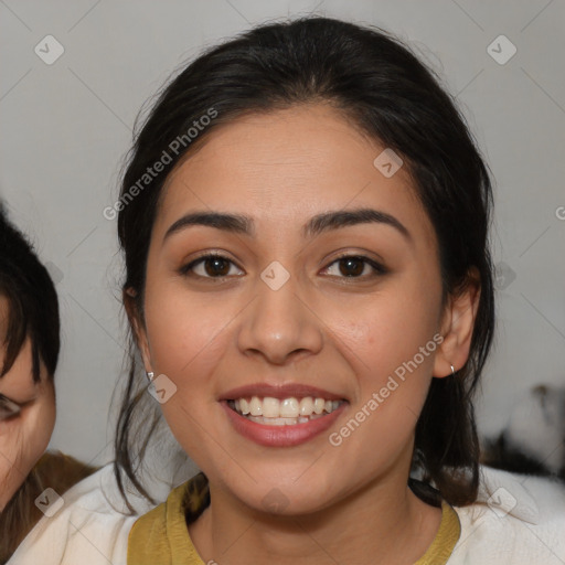 Joyful latino young-adult female with medium  brown hair and brown eyes