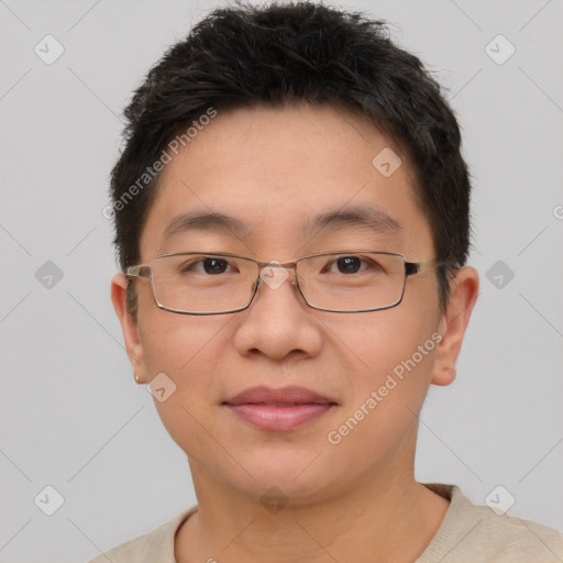 Joyful asian young-adult male with short  brown hair and brown eyes