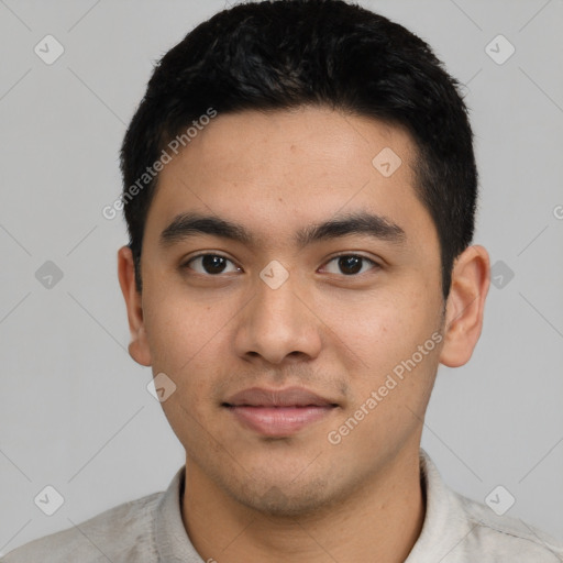 Joyful latino young-adult male with short  black hair and brown eyes