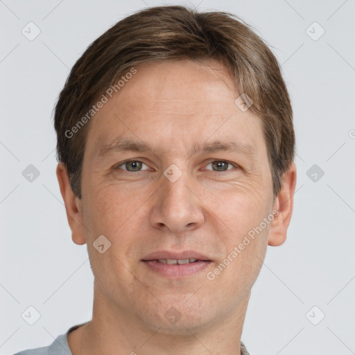 Joyful white adult male with short  brown hair and grey eyes