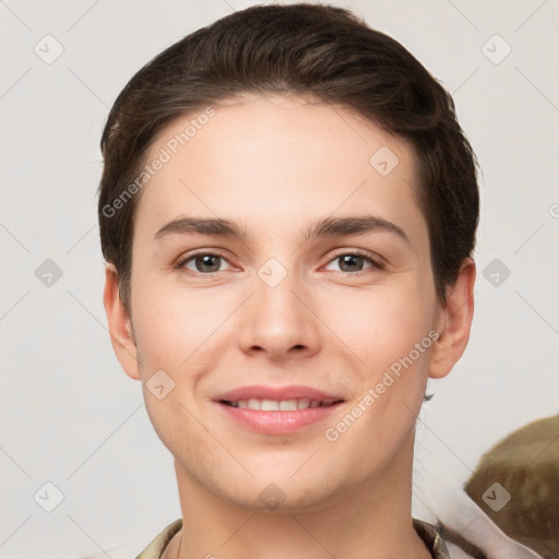 Joyful white young-adult female with short  brown hair and grey eyes