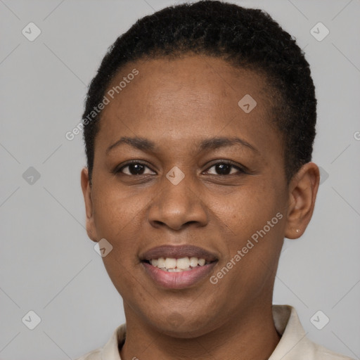 Joyful black young-adult female with short  black hair and brown eyes