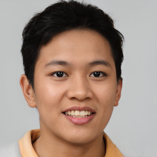 Joyful asian young-adult female with short  brown hair and brown eyes