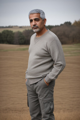 Arab middle-aged male with  gray hair