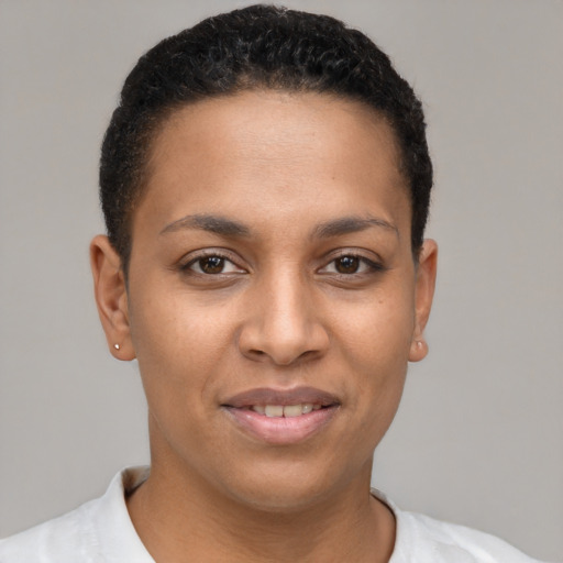 Joyful latino young-adult female with short  brown hair and brown eyes
