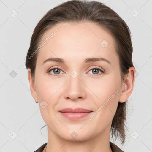 Joyful white young-adult female with medium  brown hair and grey eyes