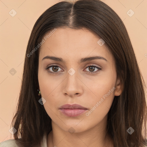 Neutral white young-adult female with long  brown hair and brown eyes