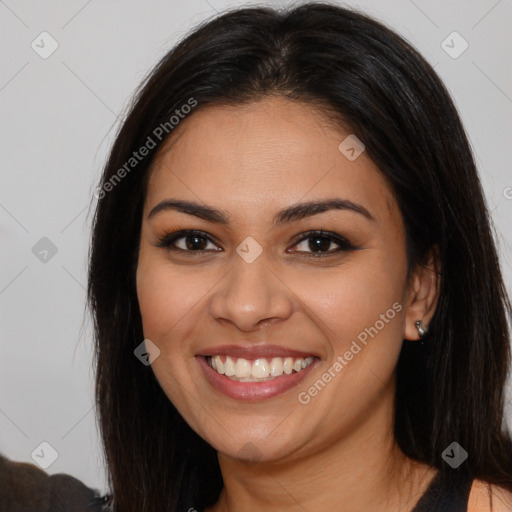 Joyful latino young-adult female with long  brown hair and brown eyes