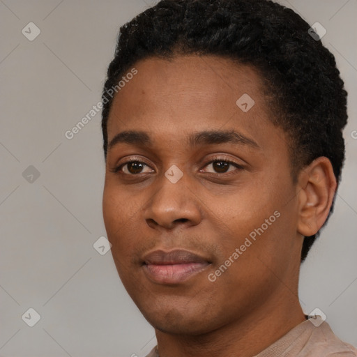 Joyful black young-adult male with short  black hair and brown eyes