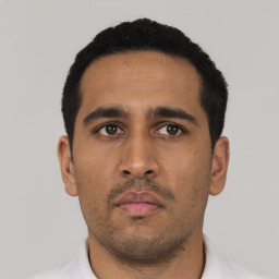 Neutral latino young-adult male with short  black hair and brown eyes