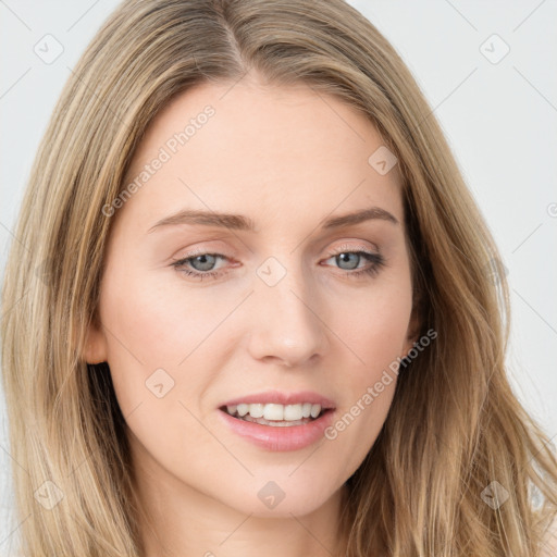 Joyful white young-adult female with long  brown hair and blue eyes