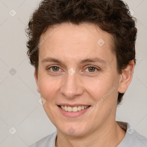 Joyful white adult female with short  brown hair and brown eyes