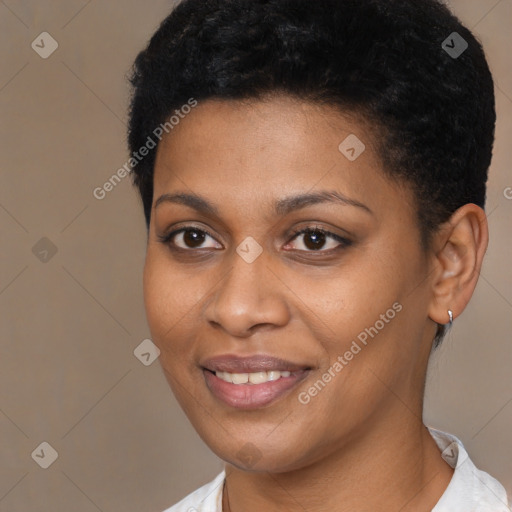 Joyful black young-adult female with short  black hair and brown eyes