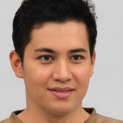 Joyful latino young-adult male with short  brown hair and brown eyes