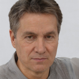 Joyful white middle-aged male with short  brown hair and brown eyes