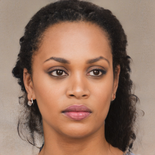 Neutral black young-adult female with medium  brown hair and brown eyes