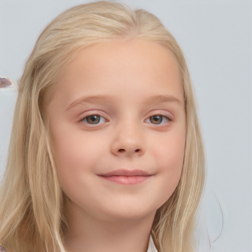 Joyful white child female with medium  blond hair and blue eyes