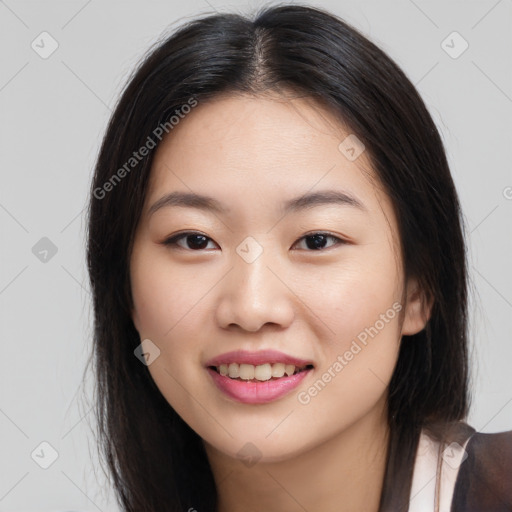 Joyful asian young-adult female with long  brown hair and brown eyes