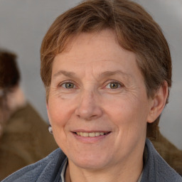 Joyful white adult female with short  brown hair and brown eyes