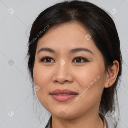 Joyful asian young-adult female with medium  brown hair and brown eyes