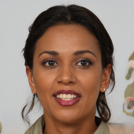 Joyful latino young-adult female with medium  brown hair and brown eyes