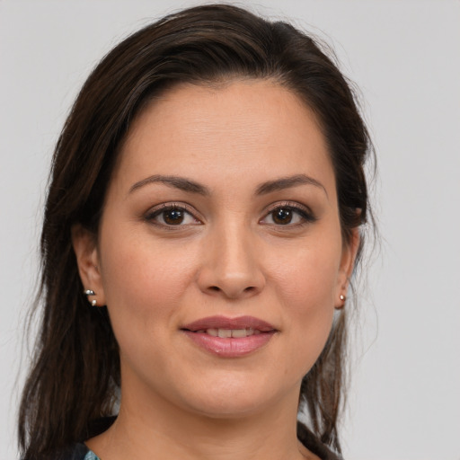 Joyful white young-adult female with medium  brown hair and brown eyes