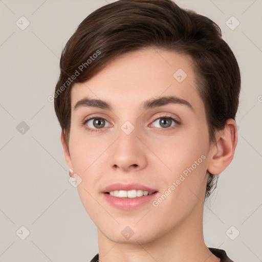 Joyful white young-adult female with short  brown hair and grey eyes