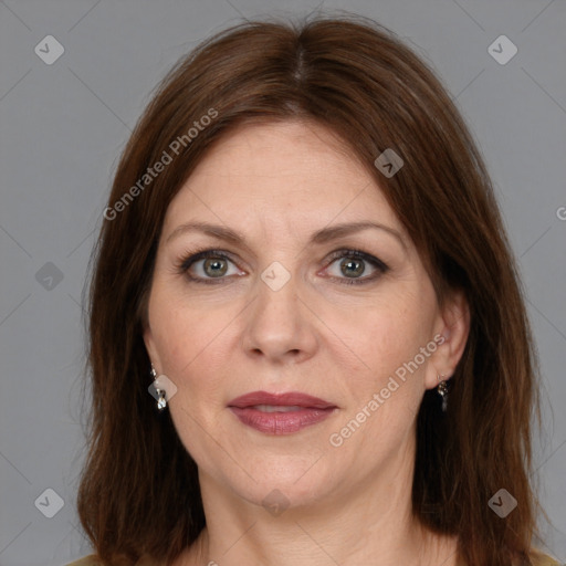 Joyful white adult female with medium  brown hair and brown eyes