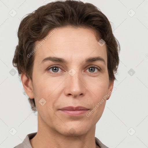 Joyful white adult female with short  brown hair and grey eyes