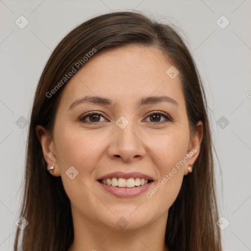 Joyful white young-adult female with long  brown hair and brown eyes