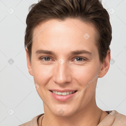 Joyful white young-adult female with short  brown hair and grey eyes