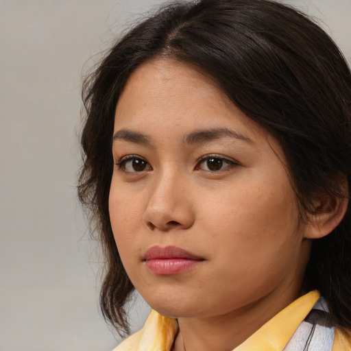 Neutral asian young-adult female with medium  brown hair and brown eyes