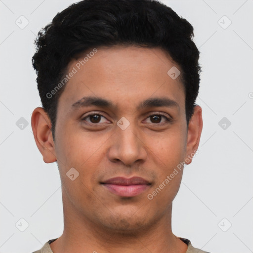 Joyful latino young-adult male with short  black hair and brown eyes