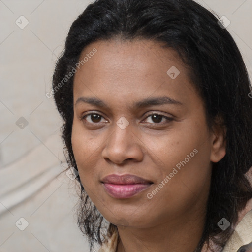 Joyful black adult female with medium  brown hair and brown eyes