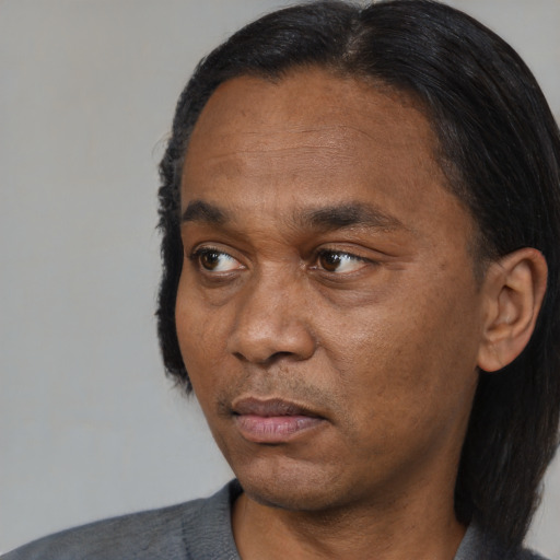 Joyful asian adult male with short  black hair and brown eyes